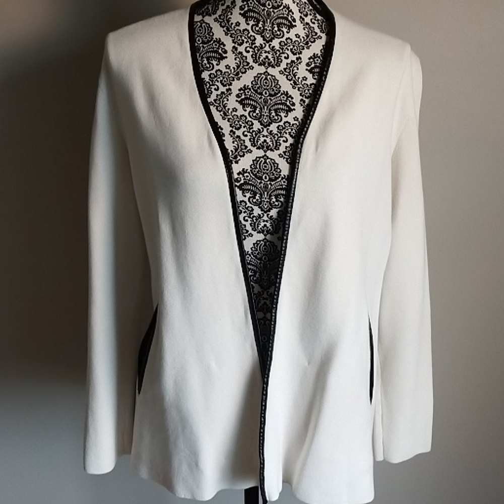 Knit cardigan with leather trim.